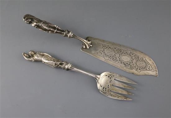 A pair of Victorian silver fish servers, with cast figural handles modelled as a fisherman and his wife, Francis Higgins III,